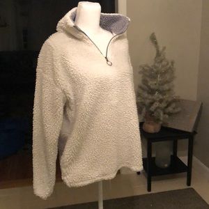 White 1/4 zip Sherpa pullover jacket.